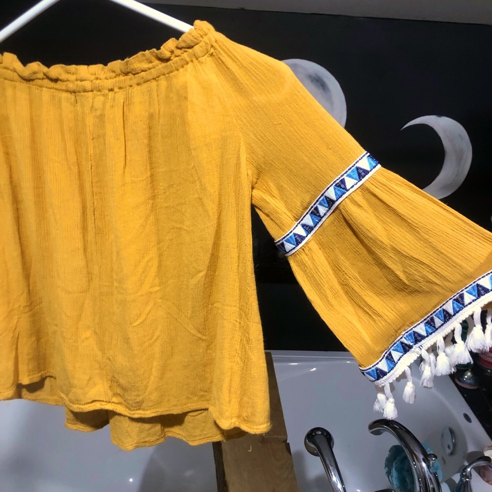Women’s mustard colored tassel blouse